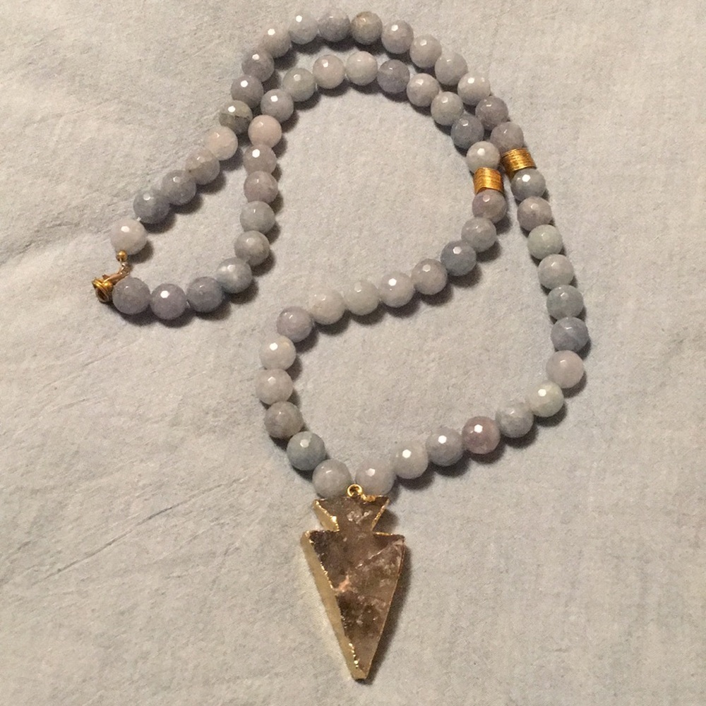 Necklace with glass beads and gold plated arrow